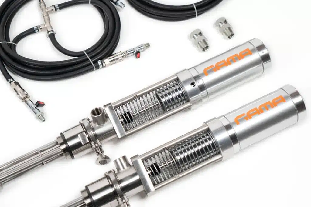 Two stainless-steel GAMA transfer pumps with hoses and fittings